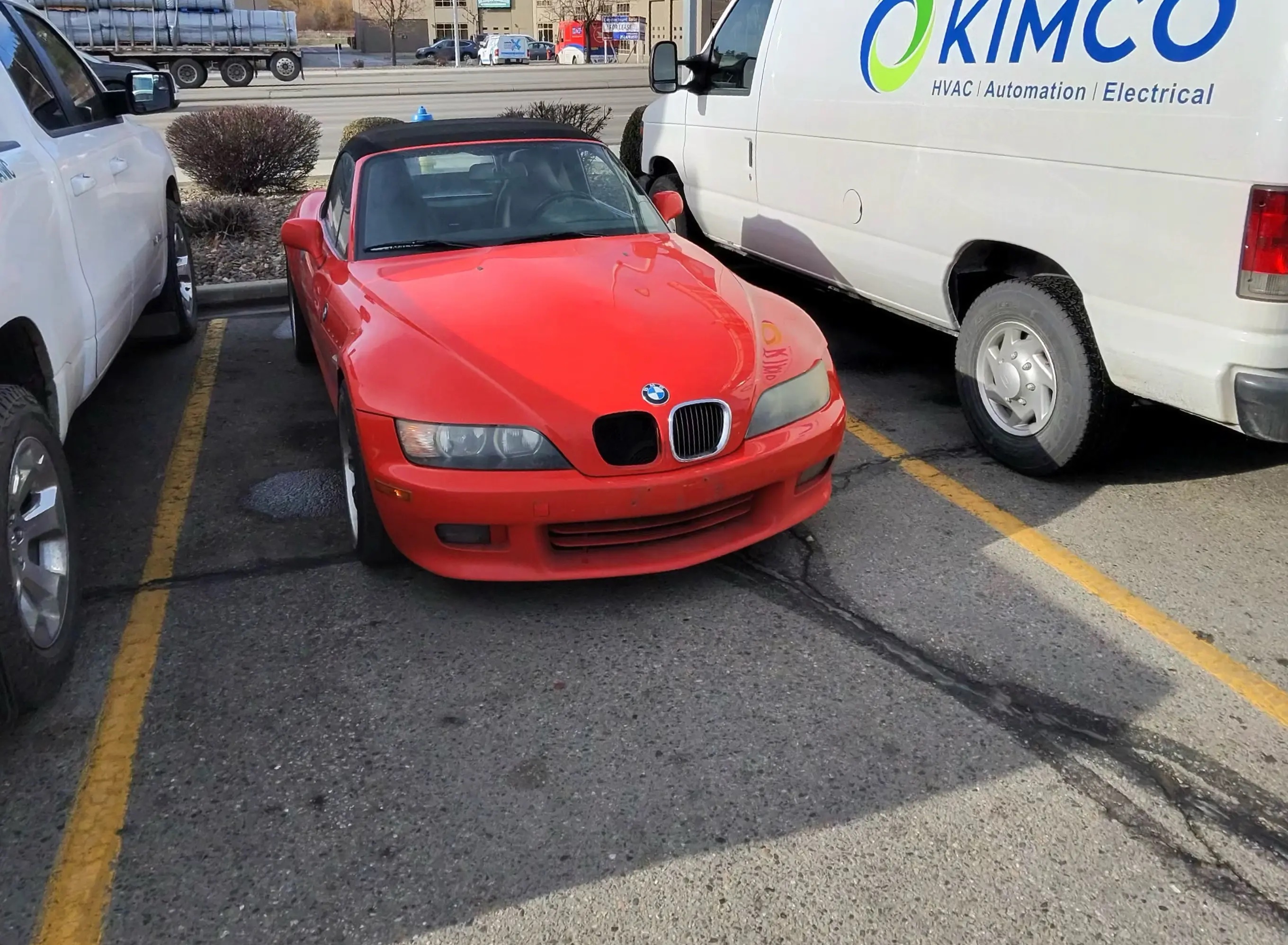 Red BMW Z3 roadster in Kelowna commercial parking lot