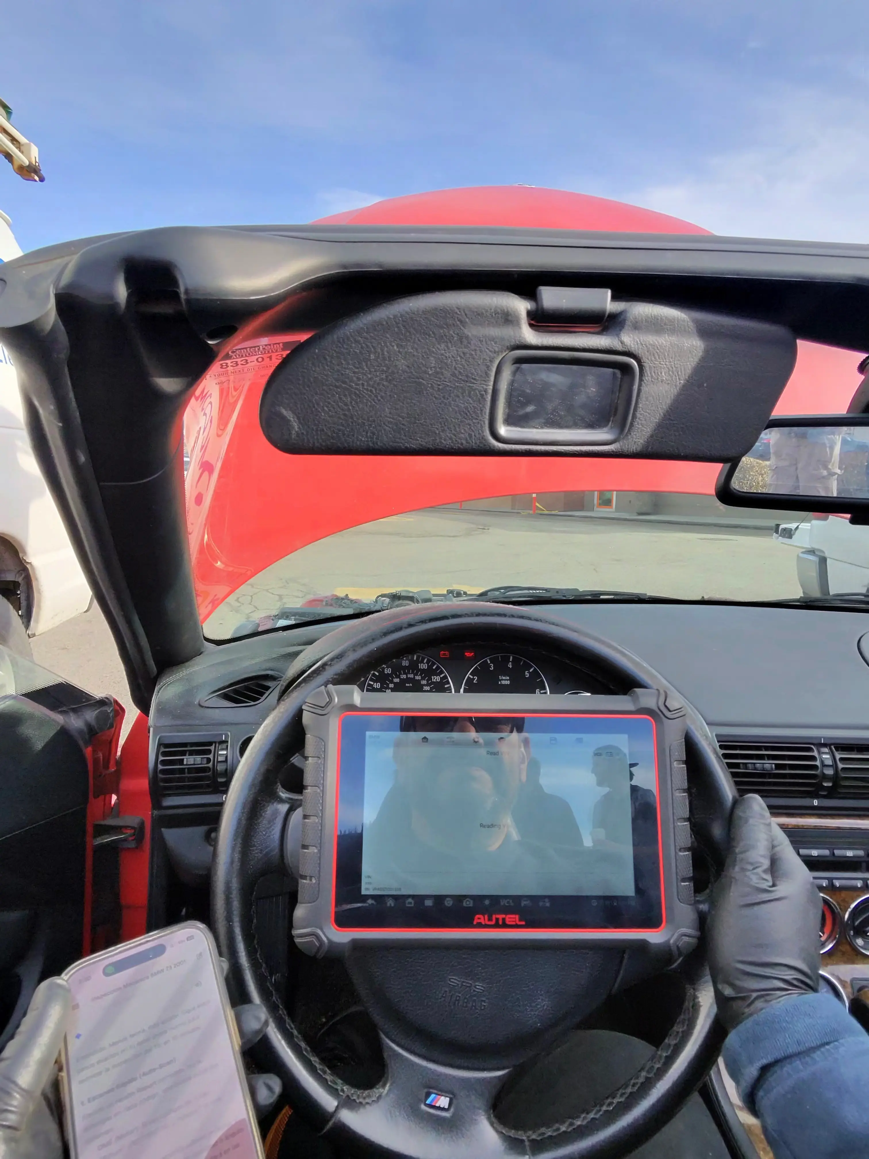 Autel diagnostic scanner connected inside BMW Z3